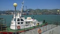 A small ship moored to the pier in the port Royalty Free Stock Photo