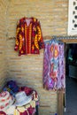 Small shop owner indian man selling shawls, clothing and souvenirs at his store. Royalty Free Stock Photo