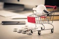 Small Cart and Bulb on the Desk Royalty Free Stock Photo