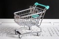 Small shopping cart / trolley on Laptop Royalty Free Stock Photo