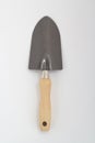 Small shovel with wooden handle, gardening tool isolated