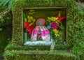 Small shrine to the deity o-jizou san, bodhisattva and protector of children and travellers, Japan.