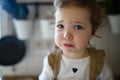 Small sick toddler girl indoors at home, looking at camera. Royalty Free Stock Photo
