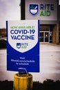 A small sign advertising the COVID-19 vaccine at a local Rite Aid drug store in Middlefield, Ohio
