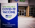 A small sign advertising the COVID-19 vaccine at a local Rite Aid drug store in Middlefield, Ohio