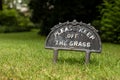 The small sign with a text Please keep off the grass to protect lawn Royalty Free Stock Photo