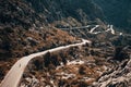 Small silhouette of rider on road bicycle, downhill on Sa Calobra, Mallorca