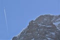 Small silhouette and skyline of airplane above the mountain near KlÃÂ¶ntalersee lake Royalty Free Stock Photo