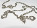 Small silver chain in abstraction. Royalty Free Stock Photo