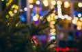 Small silver glass ball Christmas decoration on the pine on the street at night Royalty Free Stock Photo