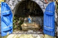 Small and simple altar with a figure of an Afro-American mother with her son Royalty Free Stock Photo