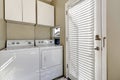 Small and simple laundry room with old-fashioned appliances