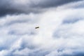 Small single engine airplane flying in the english cloudy sky