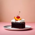 Small Single Piece of Chocolate Cake Topped with Cream and Cherry on Plate, on Peach Background Royalty Free Stock Photo