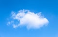 A small single white cloud on light blue sky. Cumulus isolated Royalty Free Stock Photo