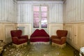 small sitting room at the corner of an abandoned house, Urbex In northern Italy. Urban exploration
