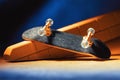 Small skateboard for skating with your fingers. fingerboard on a plaster ramp