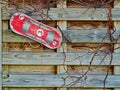 Small skateboard on wooden wall