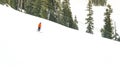Small skier over snow mountain Royalty Free Stock Photo