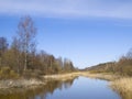 Small small river against the blue sky.