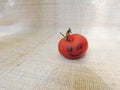 Small smiling cherry tomato Royalty Free Stock Photo