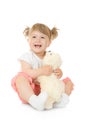 Small smiling girl with toy bear Royalty Free Stock Photo