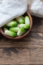 Small snack cocktail Dutch cucumbers Quirk variety on wooden background