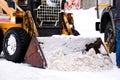 Small snow plow tractor. Snow Cleaner. Winter road works Royalty Free Stock Photo