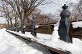 Small Snowman on a Row of Empty Benches Covered in Snow at Central Park in New York City during Winter Royalty Free Stock Photo