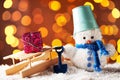 Snowman toy with wooden sleigh Royalty Free Stock Photo