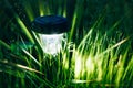 Small Solar Garden Light, Lantern In Flower Bed. Garden Design. Solar Powered Lamp Royalty Free Stock Photo