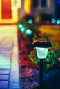 Small Solar Garden Light, Lantern In Flower Bed. Garden Design. Solar Powered Lamp Royalty Free Stock Photo