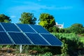 Small Solar Panel Installed In Agriculture Field With Blue Sky,