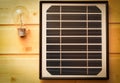 Small solar panel and a light bulb Royalty Free Stock Photo