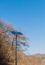 Small solar panel on top of chrome pole Royalty Free Stock Photo