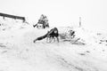 Small southern romanian village. Scenes from a moody winter with children playing with sledges and enjoying the snow