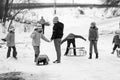 Small southern romanian village. Scenes from a moody winter with children playing with sledges and enjoying the snow