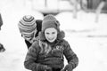 Small southern romanian village. Scenes from a moody winter with children playing with sledges and enjoying the snow