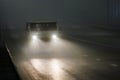 small soviet minivan car moving on night foggy road