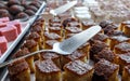 Small sponge cakes laid out on a metal tray Royalty Free Stock Photo