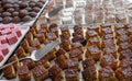 Small sponge cakes laid out on a metal tray Royalty Free Stock Photo