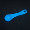 Small spoon with blue color Royalty Free Stock Photo