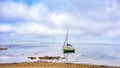 Small sports sailing boats in a row each moored next to a bolla on a shallow beach of the Mar Menor Royalty Free Stock Photo
