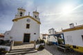 Small square with a church in traditional village  Vila Fernando  Alentejo  Portugal Royalty Free Stock Photo