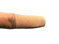 Small adhesive bandage applied on finger Royalty Free Stock Photo