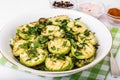 Small squash marinated in vintage crystal salad bowl