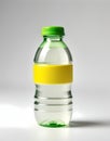 A small, squeezable plastic bottle filled with lemon juice, capped with a bright green lid, positioned at an angle Royalty Free Stock Photo