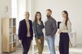 Group portrait of successful and creative business team smiling confidently looking at camera. Royalty Free Stock Photo