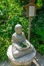 Small statue of Buddhist figure in Japanese Temple Royalty Free Stock Photo