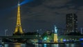 The small Statue of Liberty located near the Eiffel tower night timelapse. Paris, France Royalty Free Stock Photo